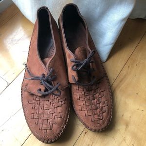 Brown leather moccasin braid detail & rubber sole.